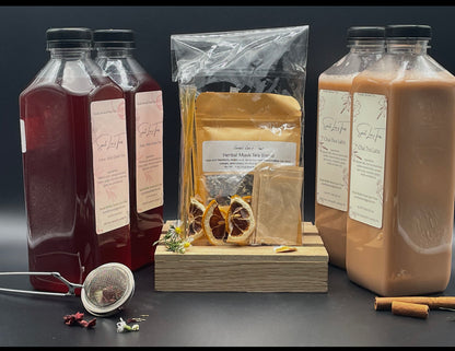 Sweet Lee’s Box of the Month featuring Pome-Mint Green Tea, Chai Tea Latte, a Herbal Mask Tea Blend kit with dried citrus, reusable tea bags, and a stainless steel tea infuser, offering a curated monthly selection of handcrafted teas.